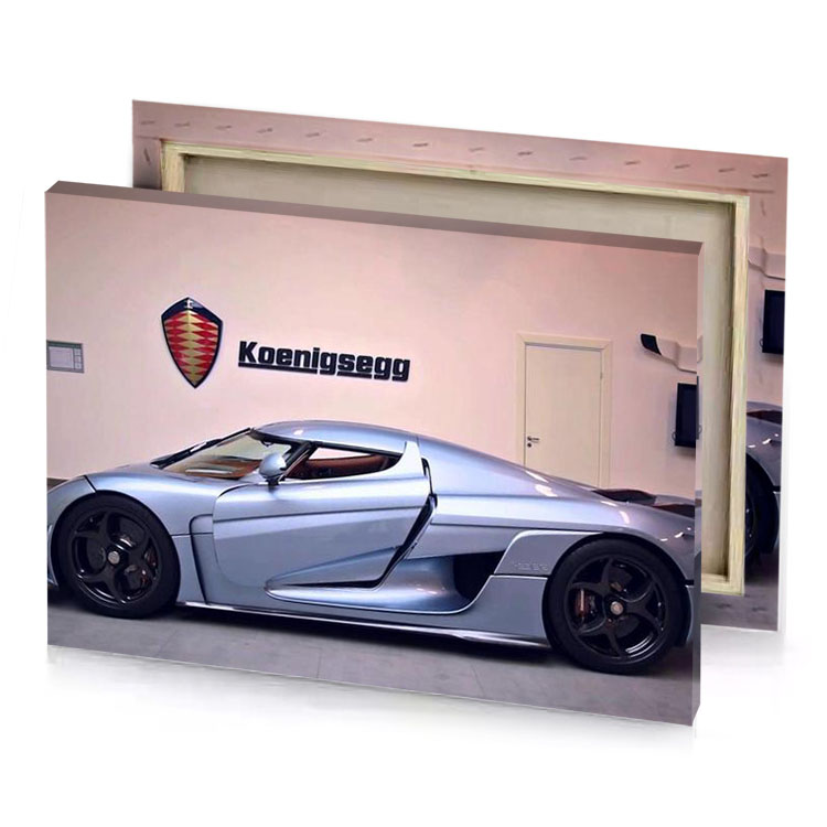 a silver car in garage with logo on the wall slate gray canvas
