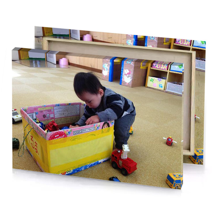 a small child playing with toy truck tan canvas