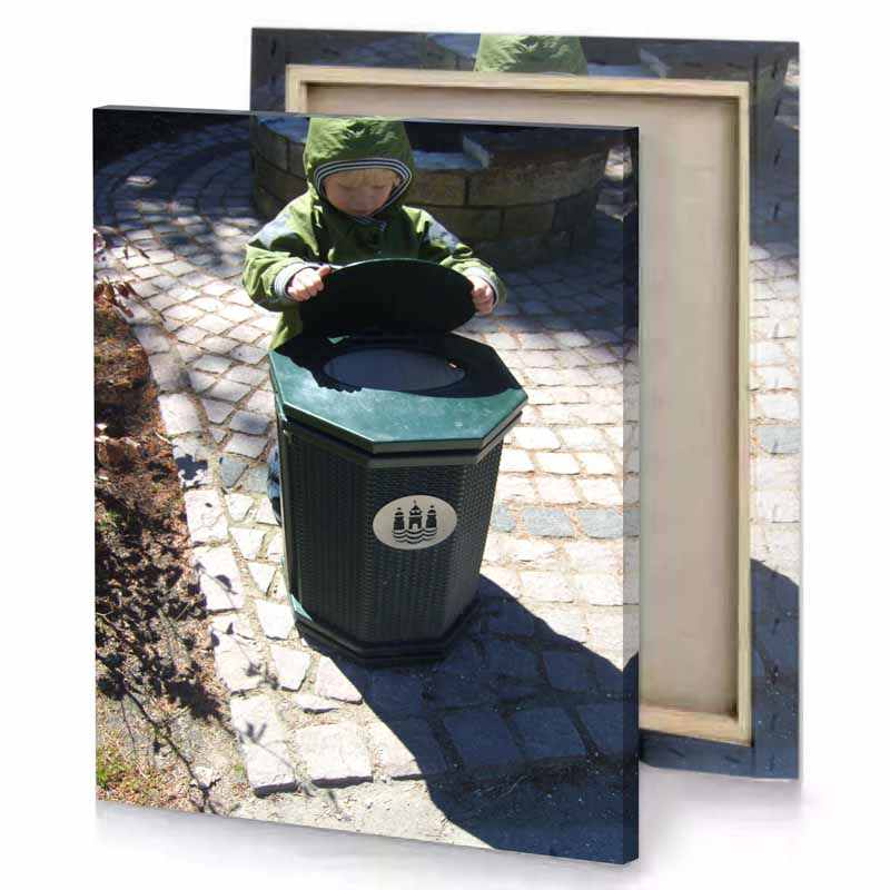 a small child standing next to trash can cadet blue canvas