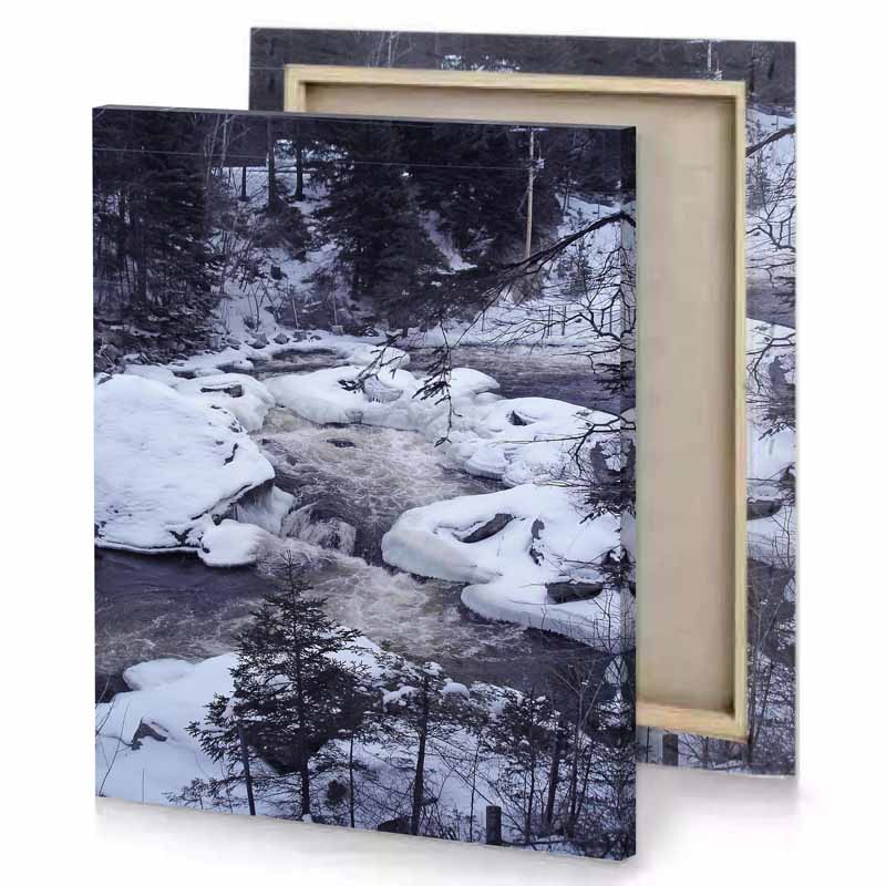a stream of water surrounded by snow covered rocks light steel blue canvas