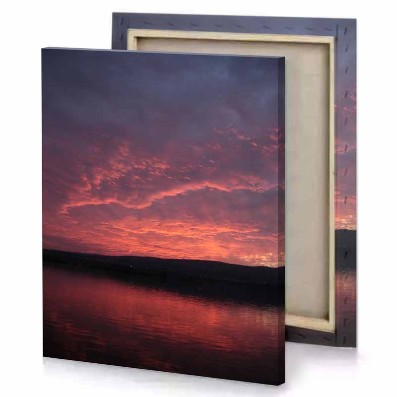 a sunset over lake with boat in the water dim gray canvas