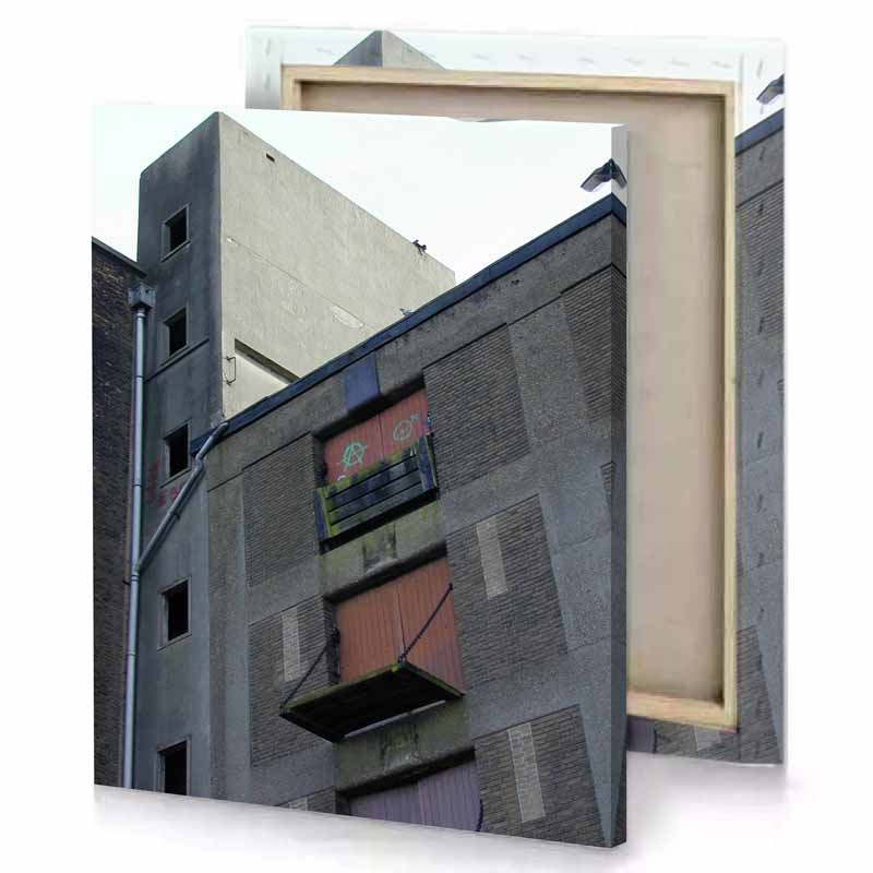a tall building with clock on the side silver canvas