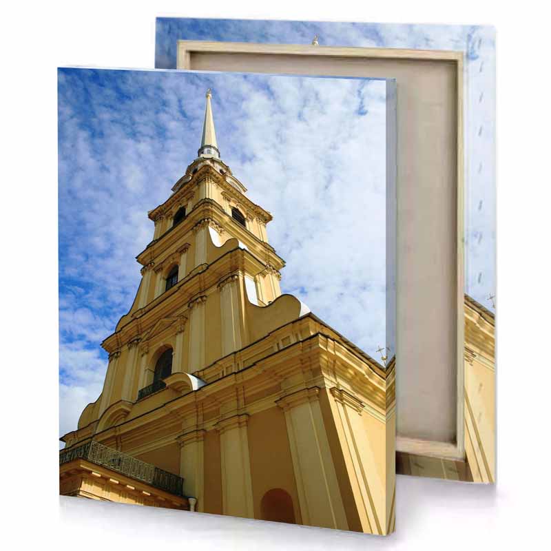 a tall yellow building with clock on the top sienna canvas