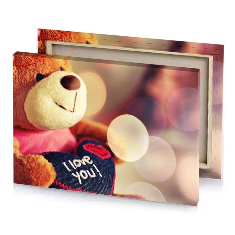 a teddy bear holding heart with the words i love tan canvas