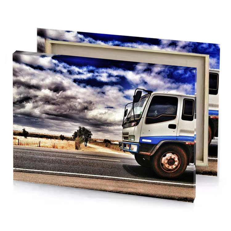 a truck is driving down the road under cloudy sky silver canvas