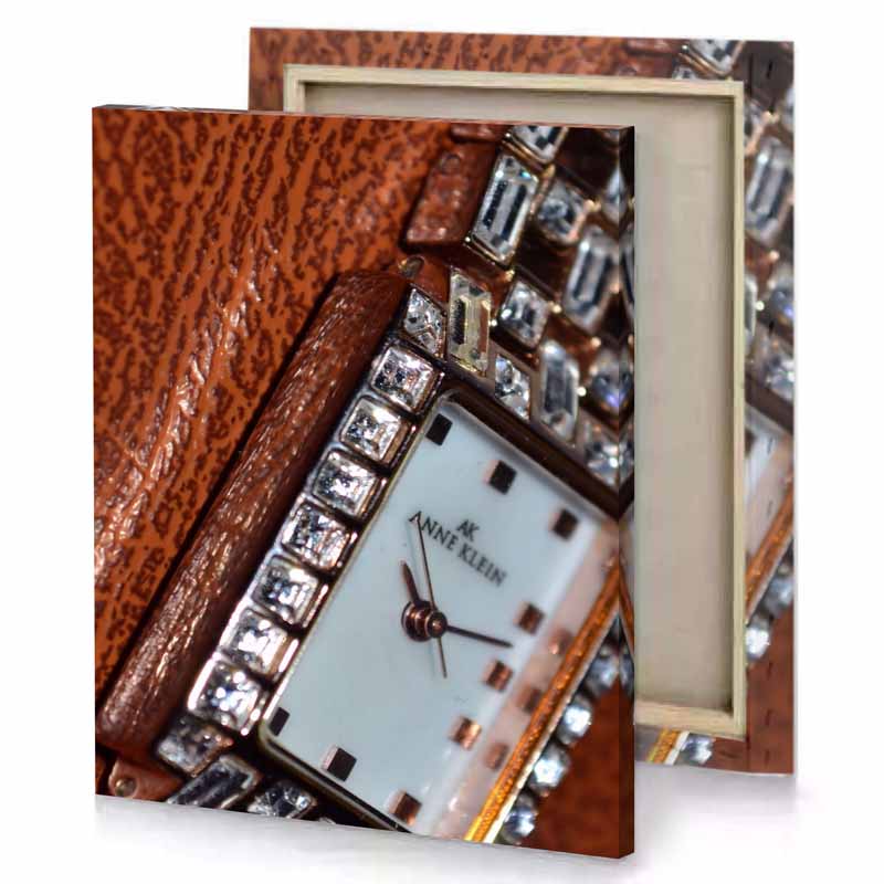 a watch with white face and silver hands saddle brown canvas