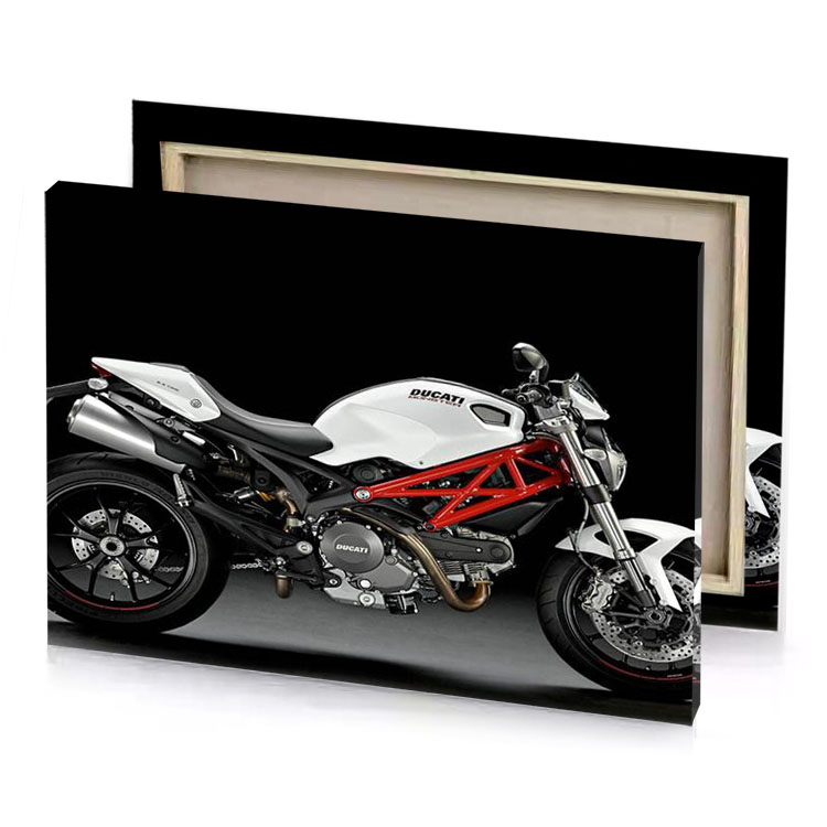 a white and red motorcycle parked in dark room garnet canvas