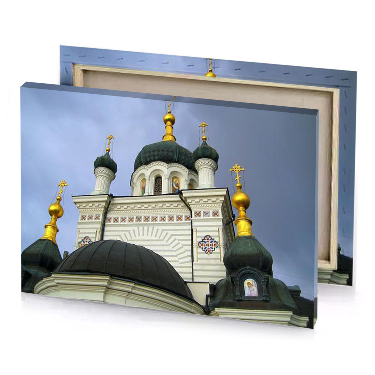 a white building with gold dome and cross on the silver canvas