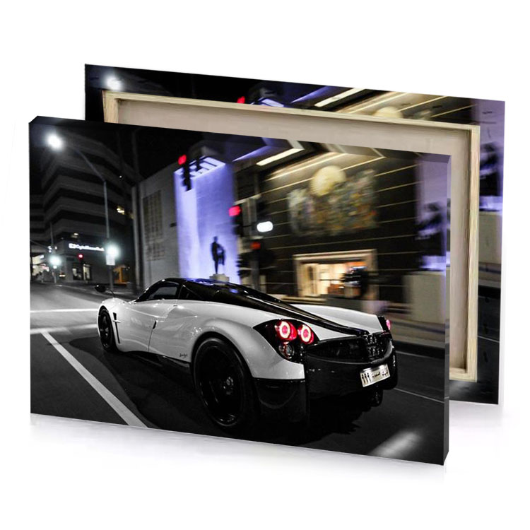 a white car driving down the street at night medium purple canvas