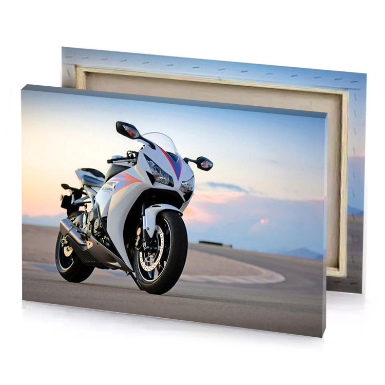 a white motorcycle parked on road next to mountain smoky black canvas