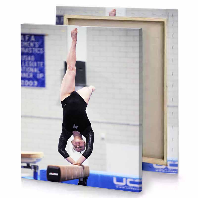 a woman doing handstant on beam platinum canvas