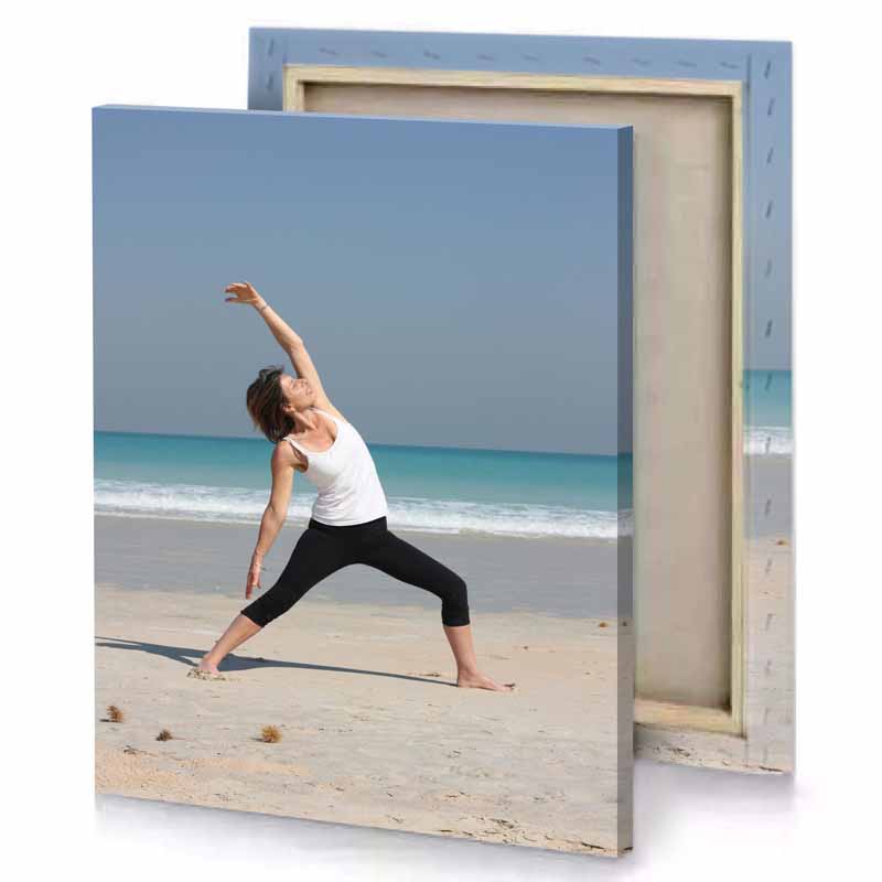 a woman doing yoga on the beach white smoke canvas