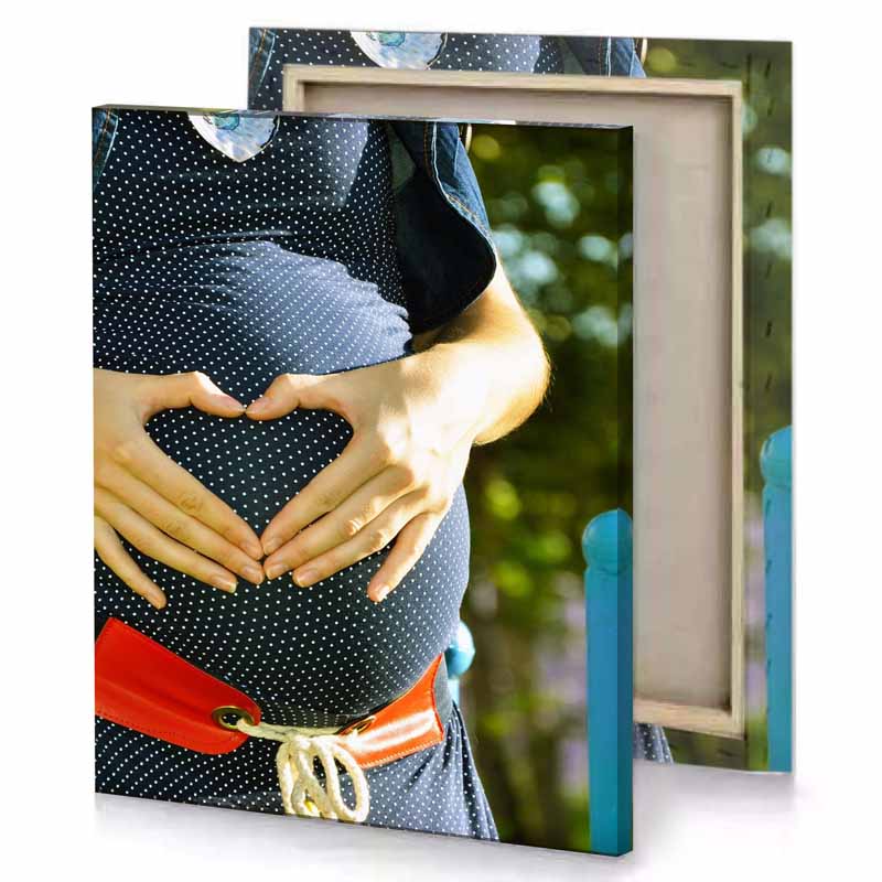 a woman holding baby bump in her belly dark khaki canvas