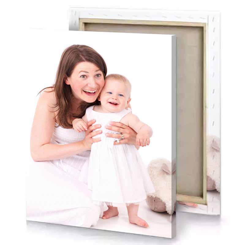 a woman holding baby in her arms white smoke canvas
