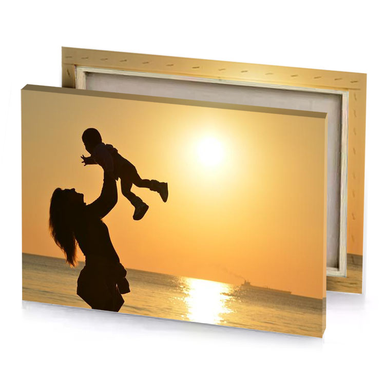 a woman holding baby on the beach sand brown canvas
