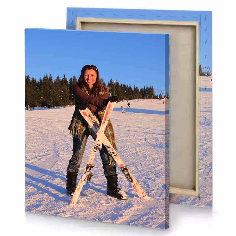 a woman holding skis in the snow iceberg canvas