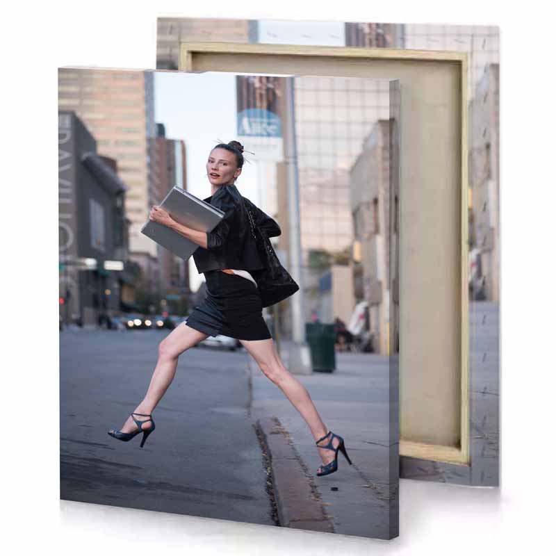 a woman in black dress and heels is jumping smoky canvas