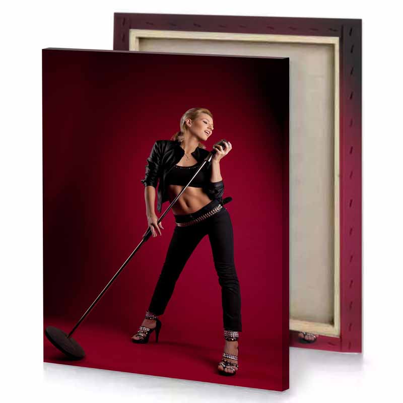 a woman in black top and pants holding cane burgundy canvas