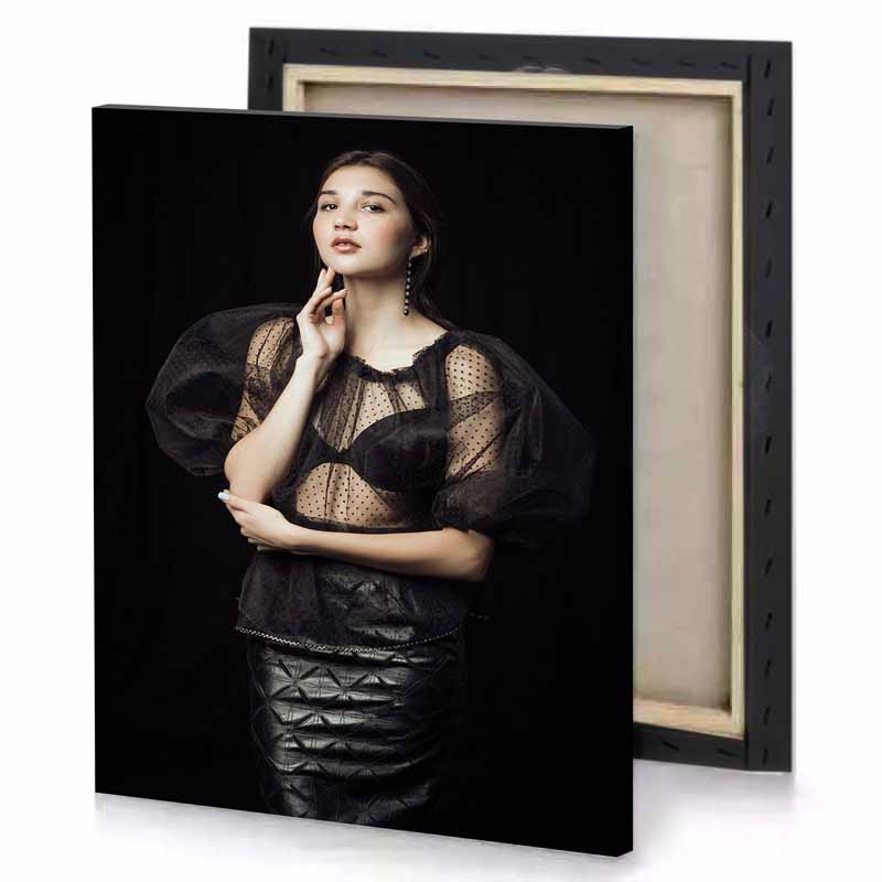 a woman in black top and skirt smoky canvas