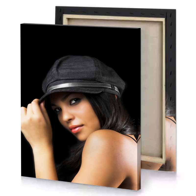 a woman in hat posing for the camera black canvas
