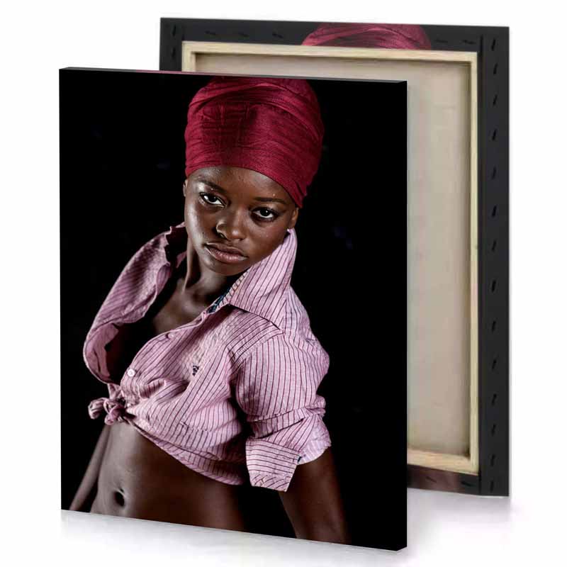 a woman in pink shirt and red turbal black canvas