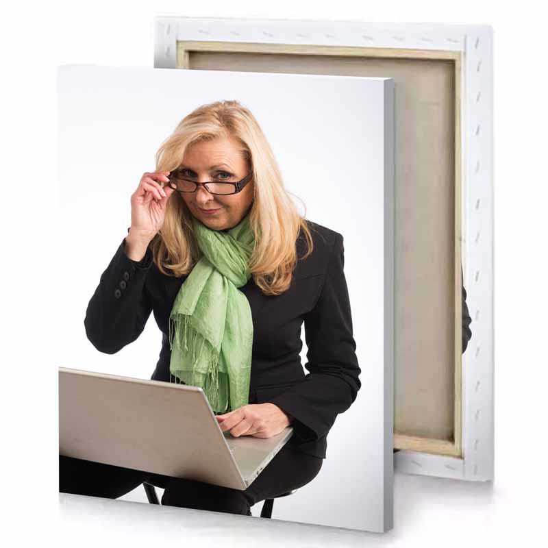 a woman in suit and tie is using laptop sage canvas