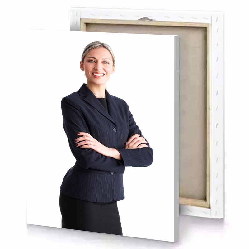 a woman in suit and tie standing with her arms white canvas