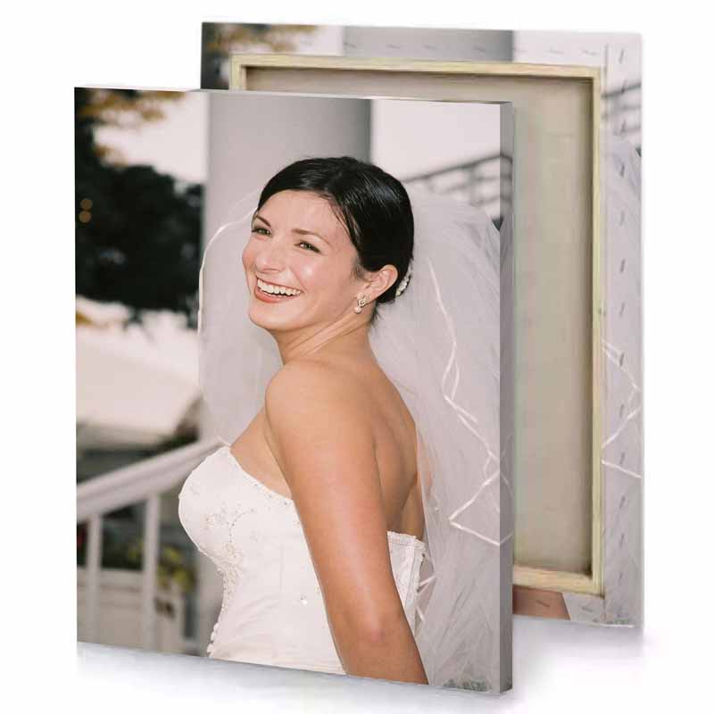 a woman in wedding dress smiles at the camera silver canvas