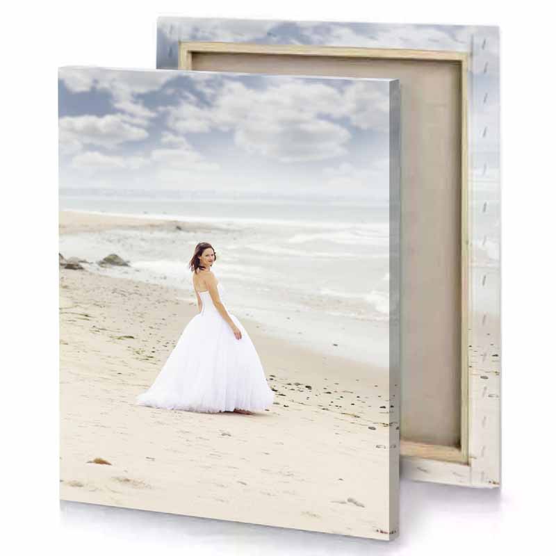 a woman in white dress standing on beach tan canvas