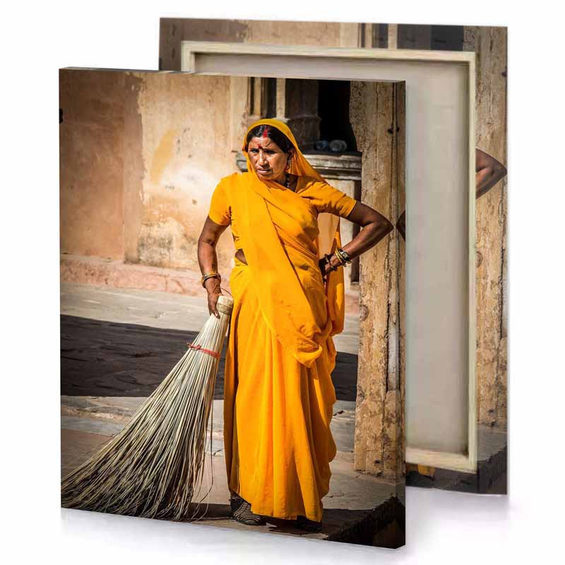 a woman in yellow dress orange canvas