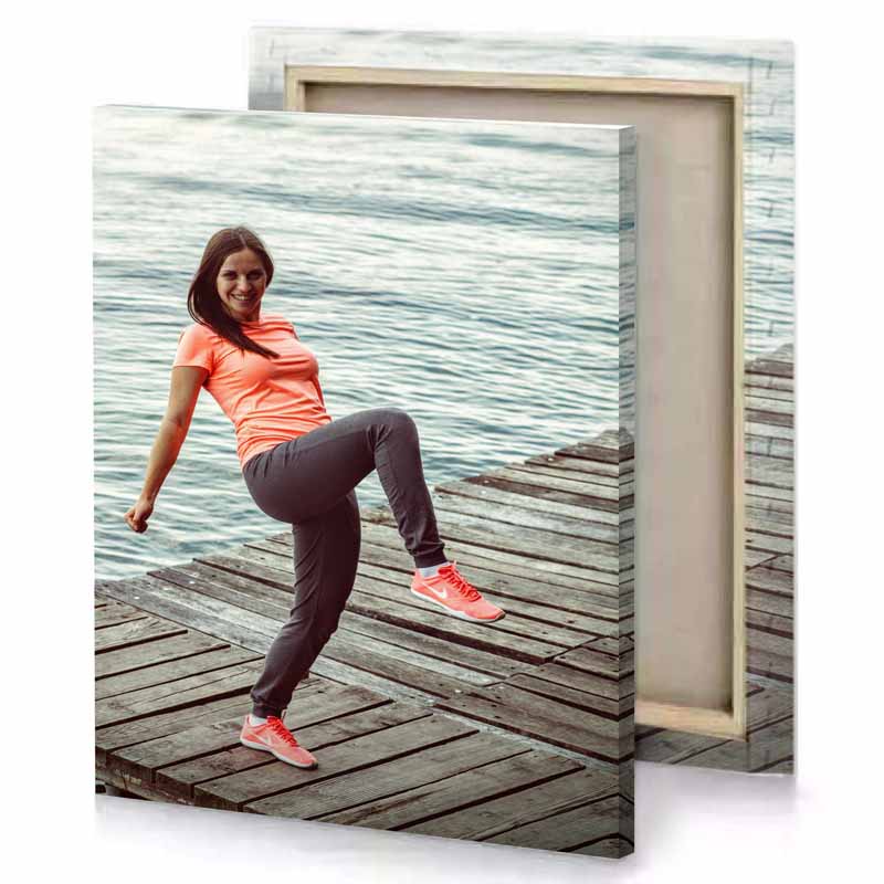 a woman is doing trick on dock salmon canvas