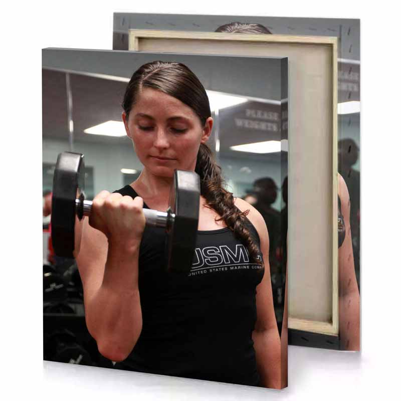 a woman is lifting pair of dumbs smoky black canvas