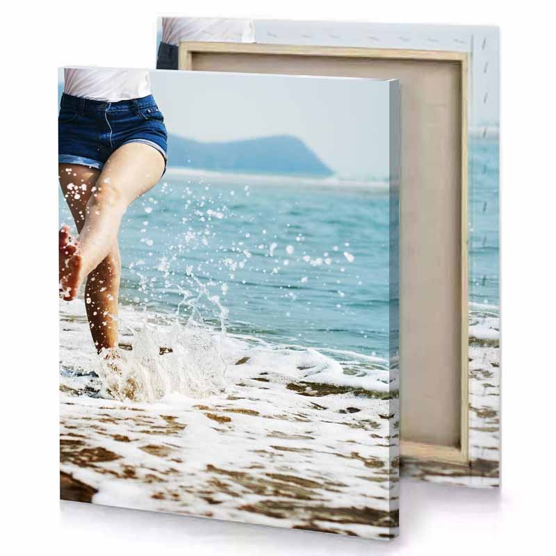 a woman is running in the water on beach light steel blue canvas