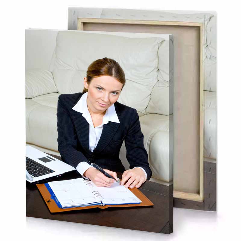 a woman sitting at table with laptop and pen silver canvas
