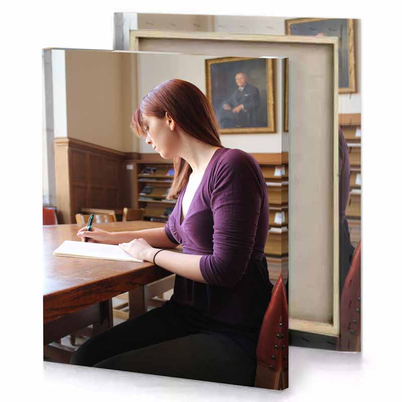 a woman sitting at table writing smoky black canvas