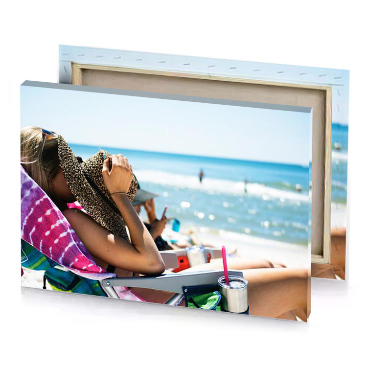 a woman sitting on beach chair with laptop light blue canvas