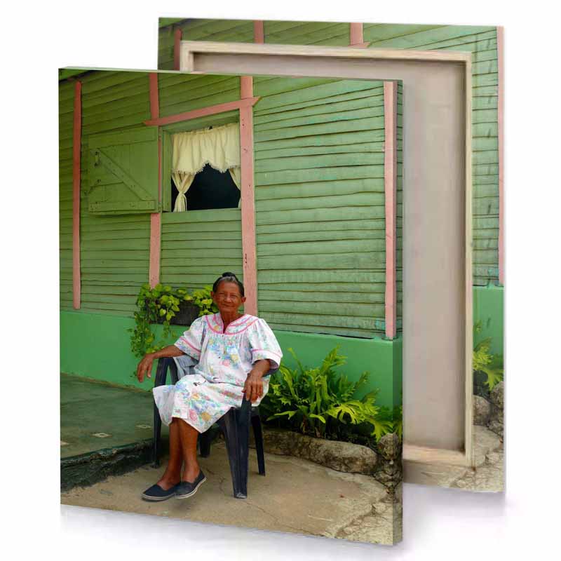 a woman sitting on chair in front of house camouflage green canvas