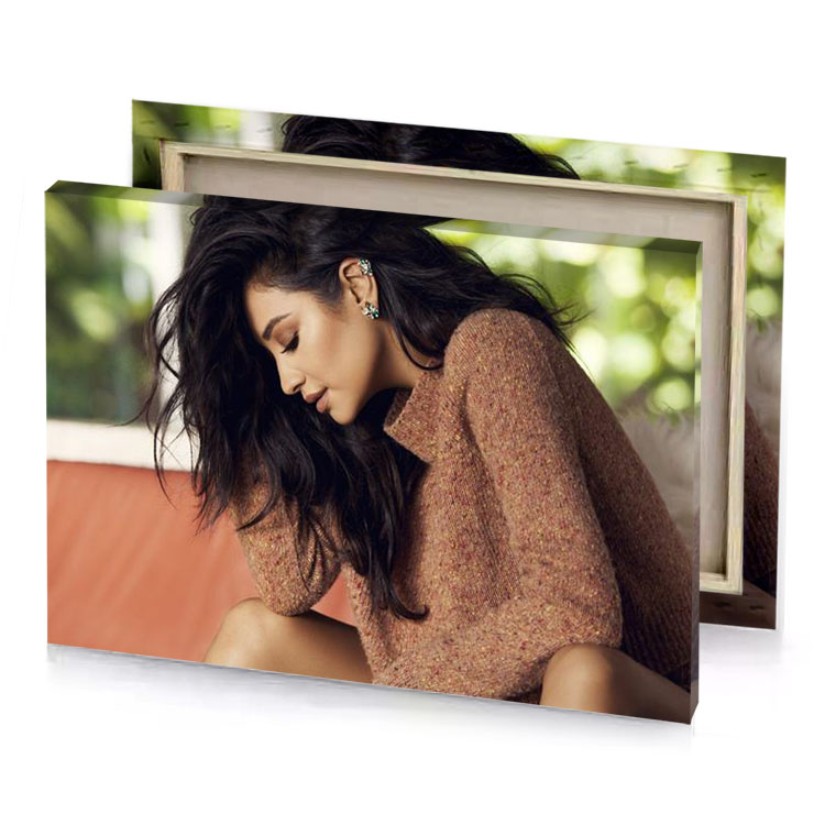 a woman sitting on couch with her head down smoky black canvas