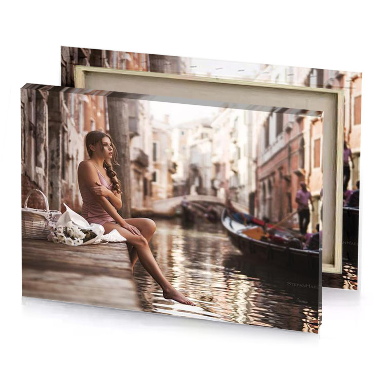 a woman sitting on ledge in canal silver canvas