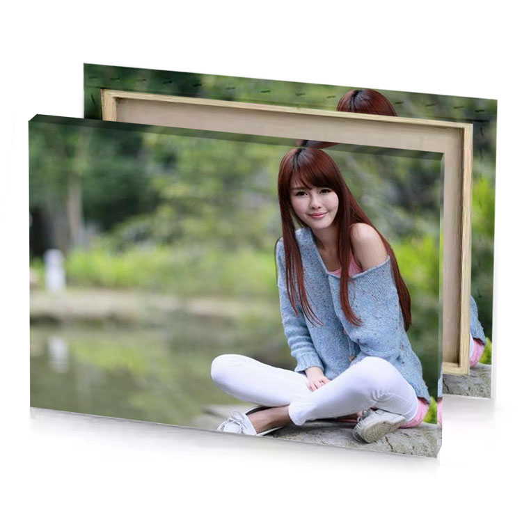 a woman sitting on rock near river camouflage green canvas