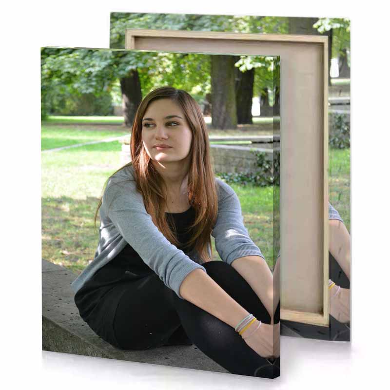 a woman sitting on stone bench in park smoky black canvas