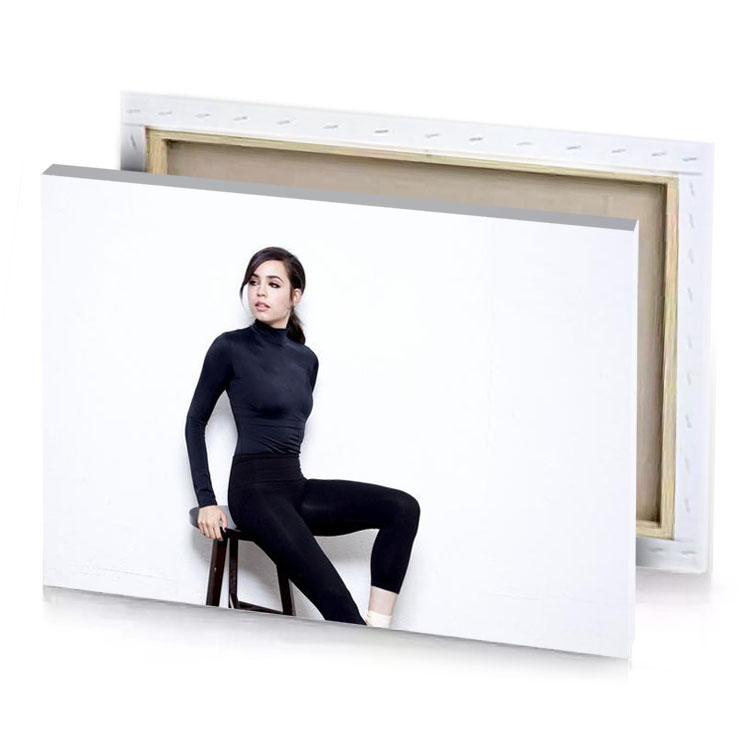 a woman sitting on stool wearing black top and leggings smoky canvas