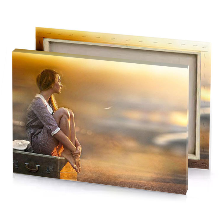 a woman sitting on suitcase in the middle of road dark golden rod canvas