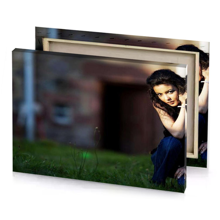 a woman sitting on the grass in front of building bistre canvas