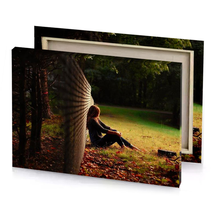 a woman sitting on the ground in woods peru canvas