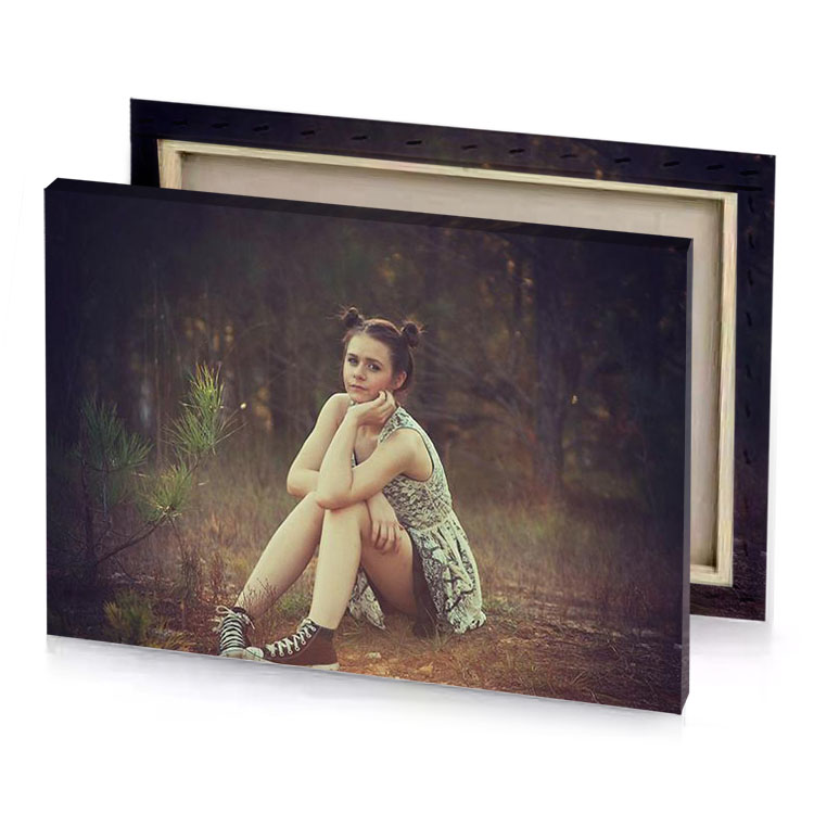 a woman sitting on the ground tan canvas