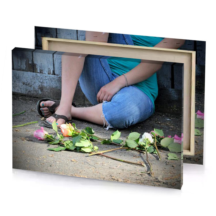 a woman sitting on the ground with her shoes iceberg canvas