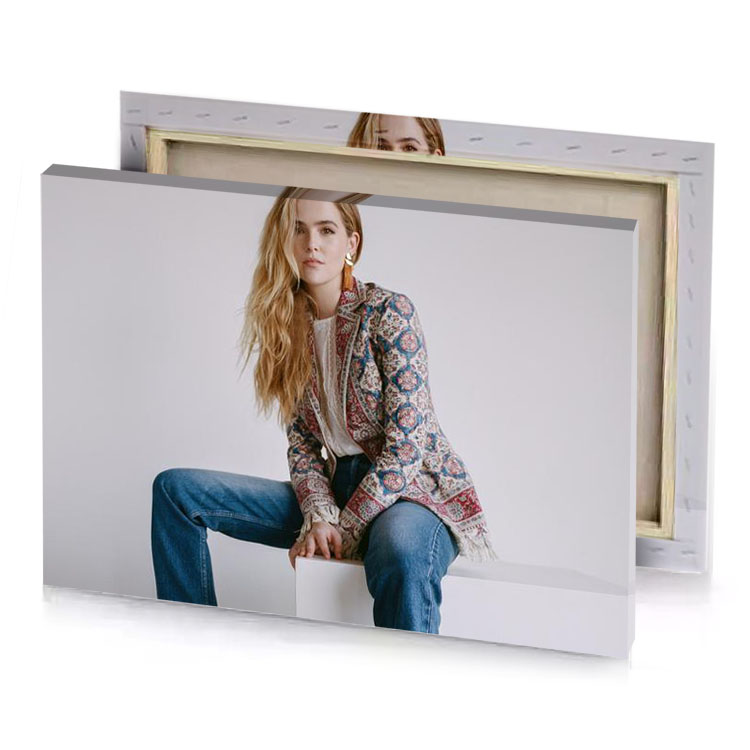 a woman sitting on white cube wearing floral jacket silver canvas