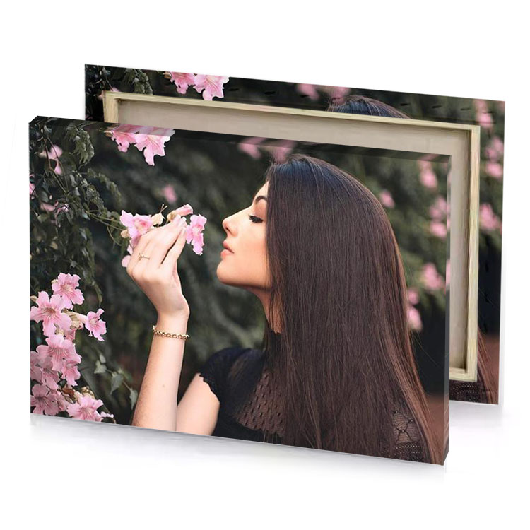 a woman smelling flower taupe canvas