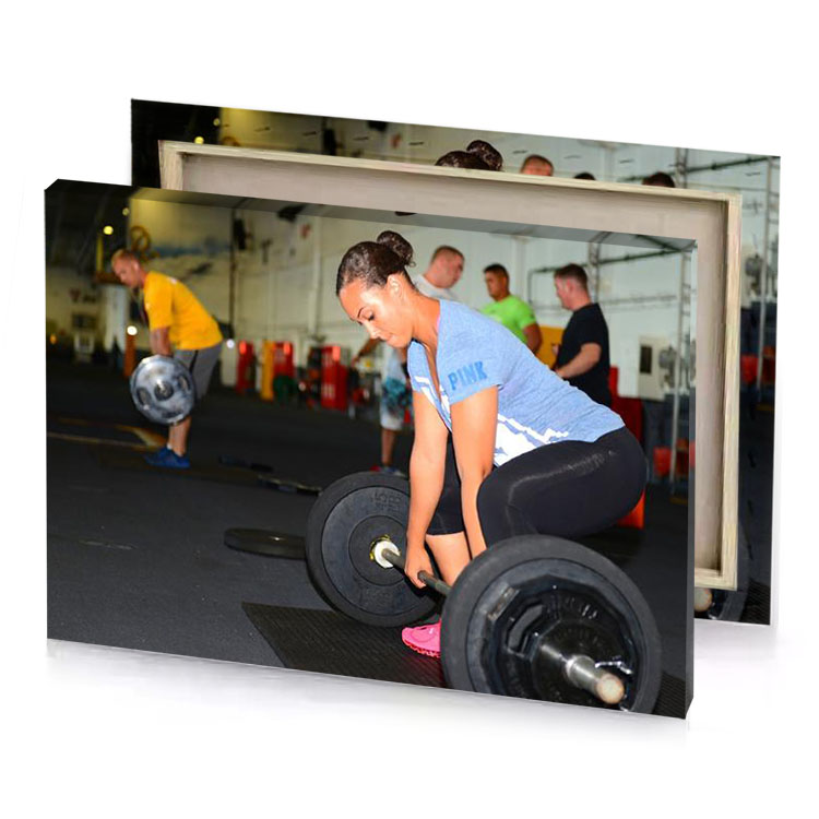 a woman squats on barbell smoky black canvas